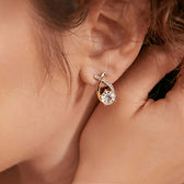 Earrings with golden cross and zirconia