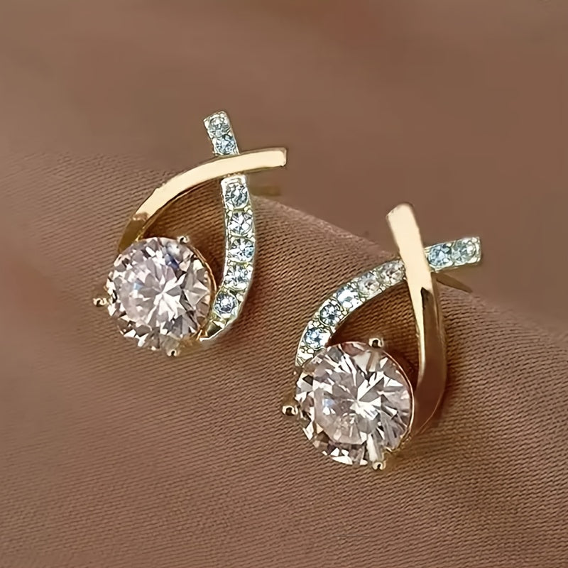 Earrings with golden cross and zirconia